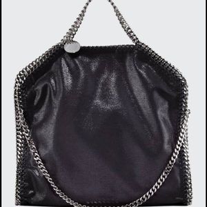 A stylish tote 14 by 15.. in measurements ..